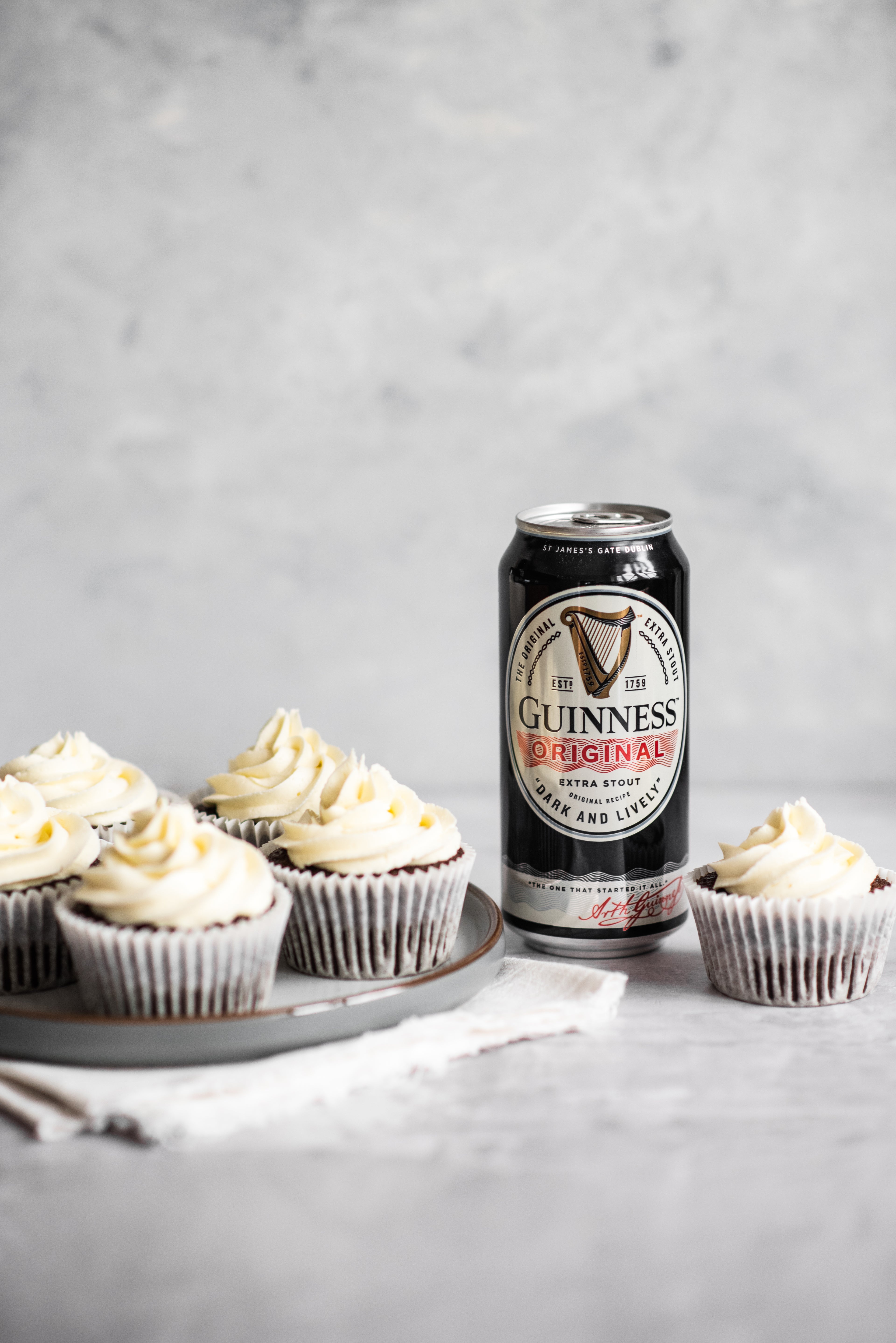 Cupcakes with a can of Guinness next to them