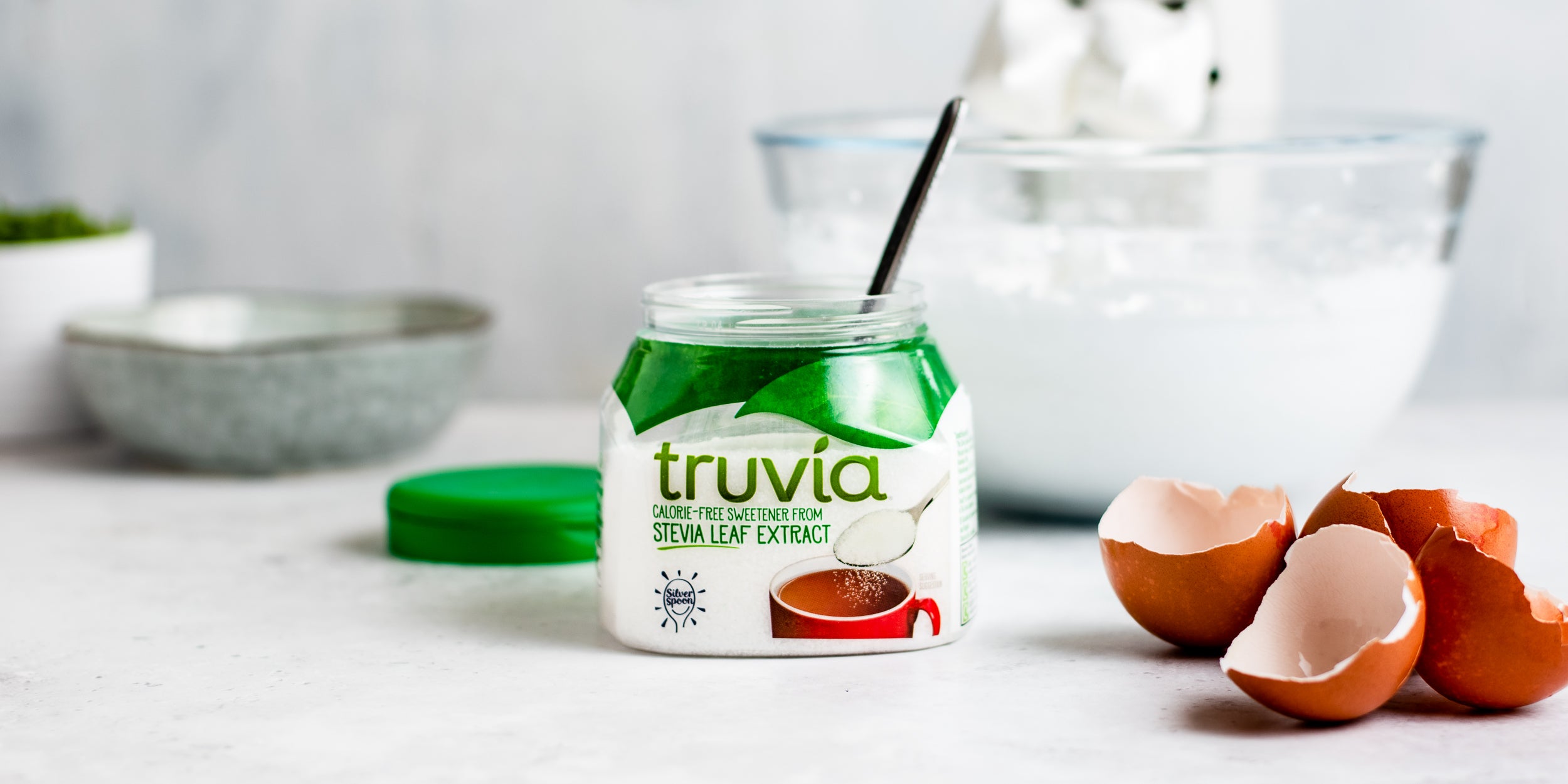 Close up of Truvia next to egg shells when making meringue for the Summer Berry Eton Mess