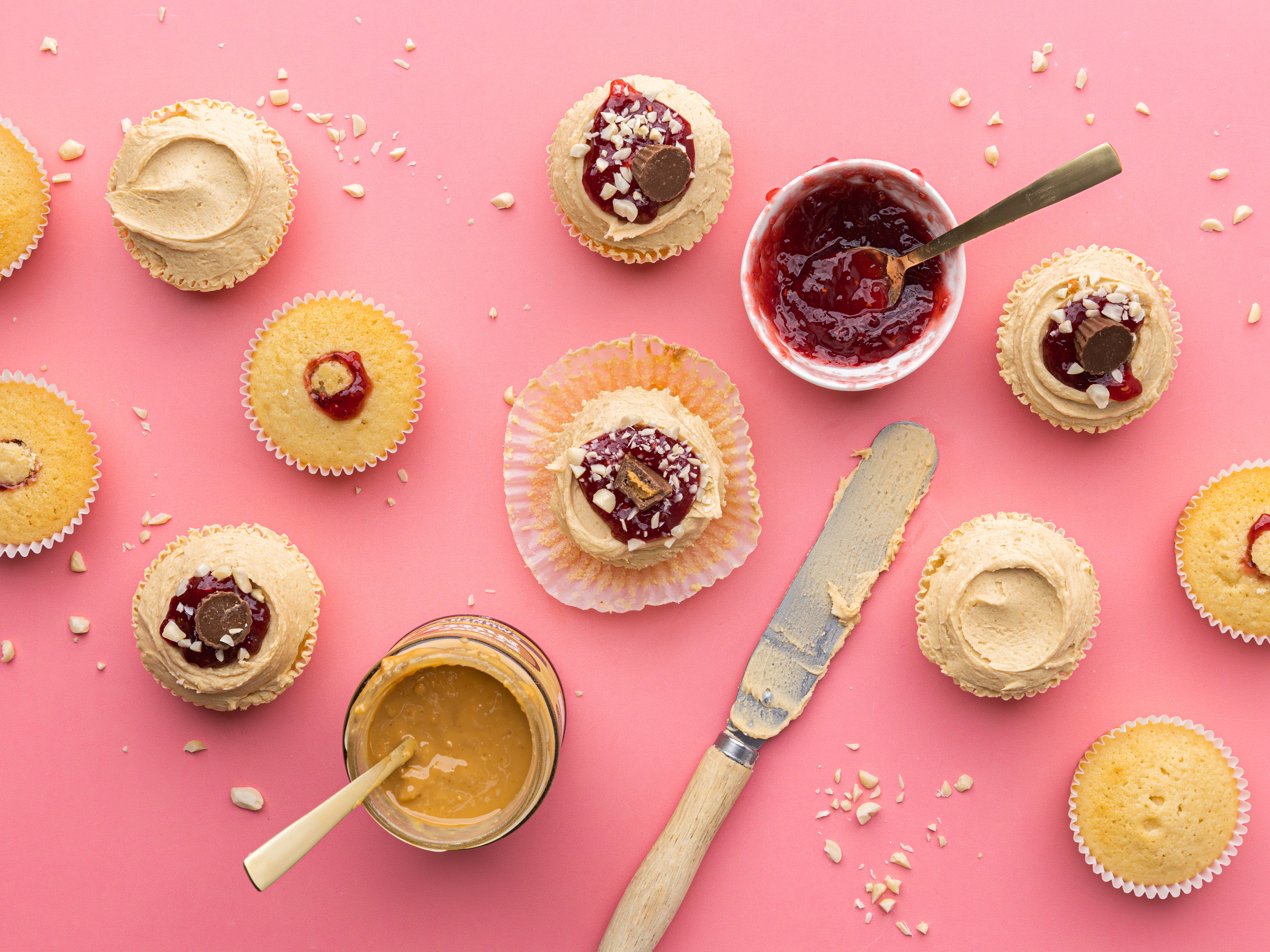 Cupcakes with peanut butter and jam bowls with spoons