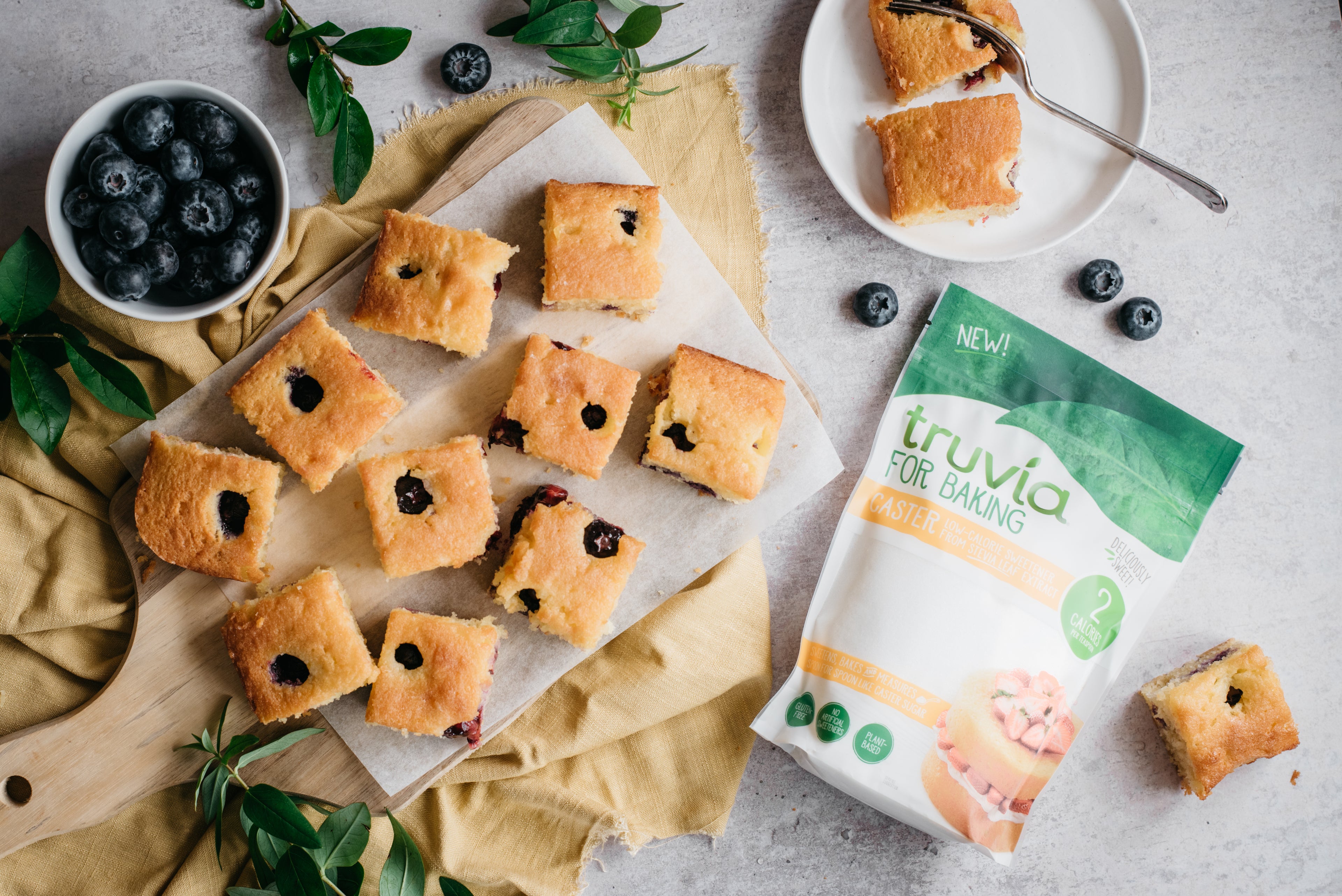 Top down view of low sugar lemon and blueberry traybake