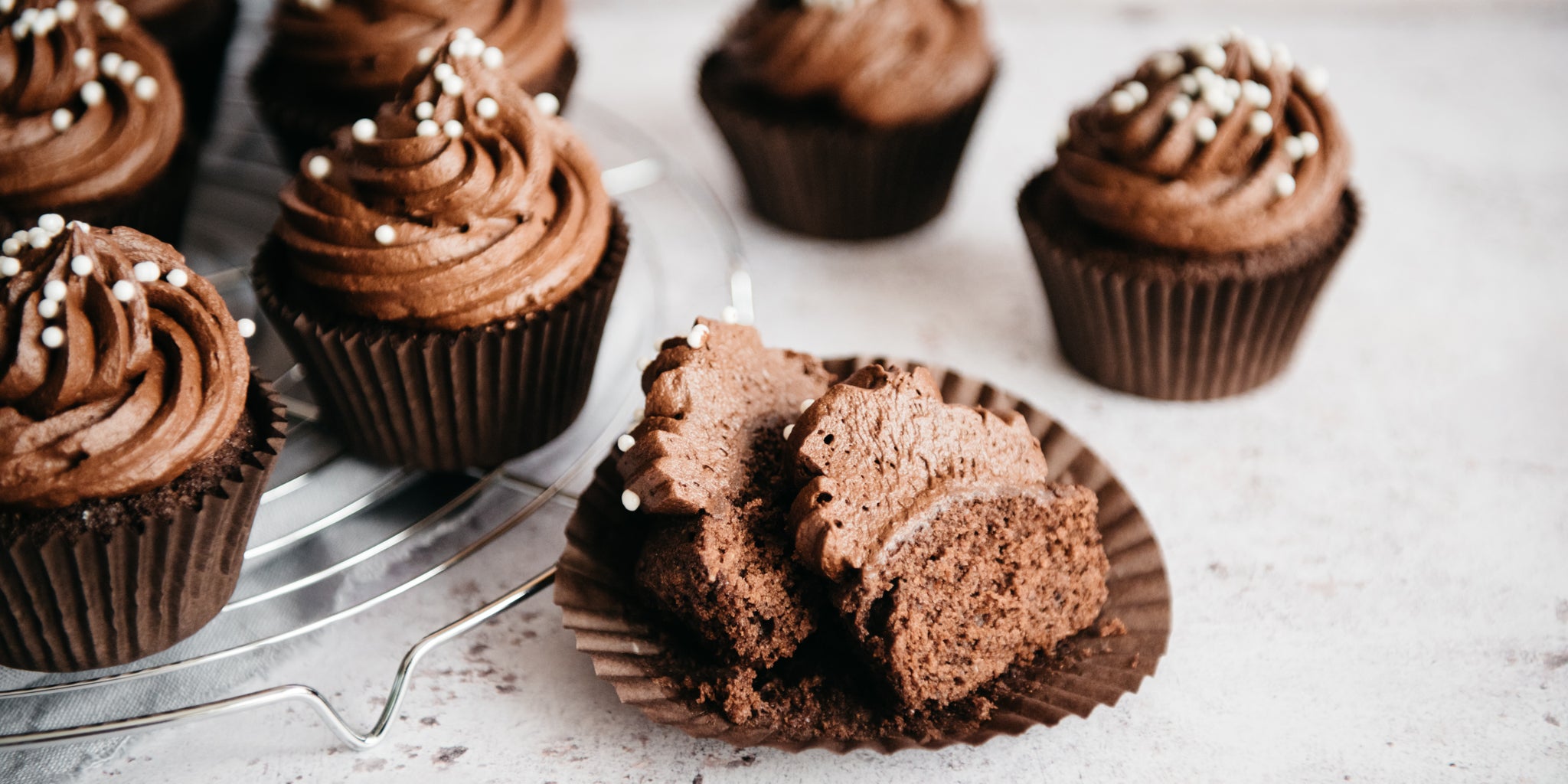 Close up of Wholemeal Chocolate Cupcakes cut in half, showing the moist rich inside. 