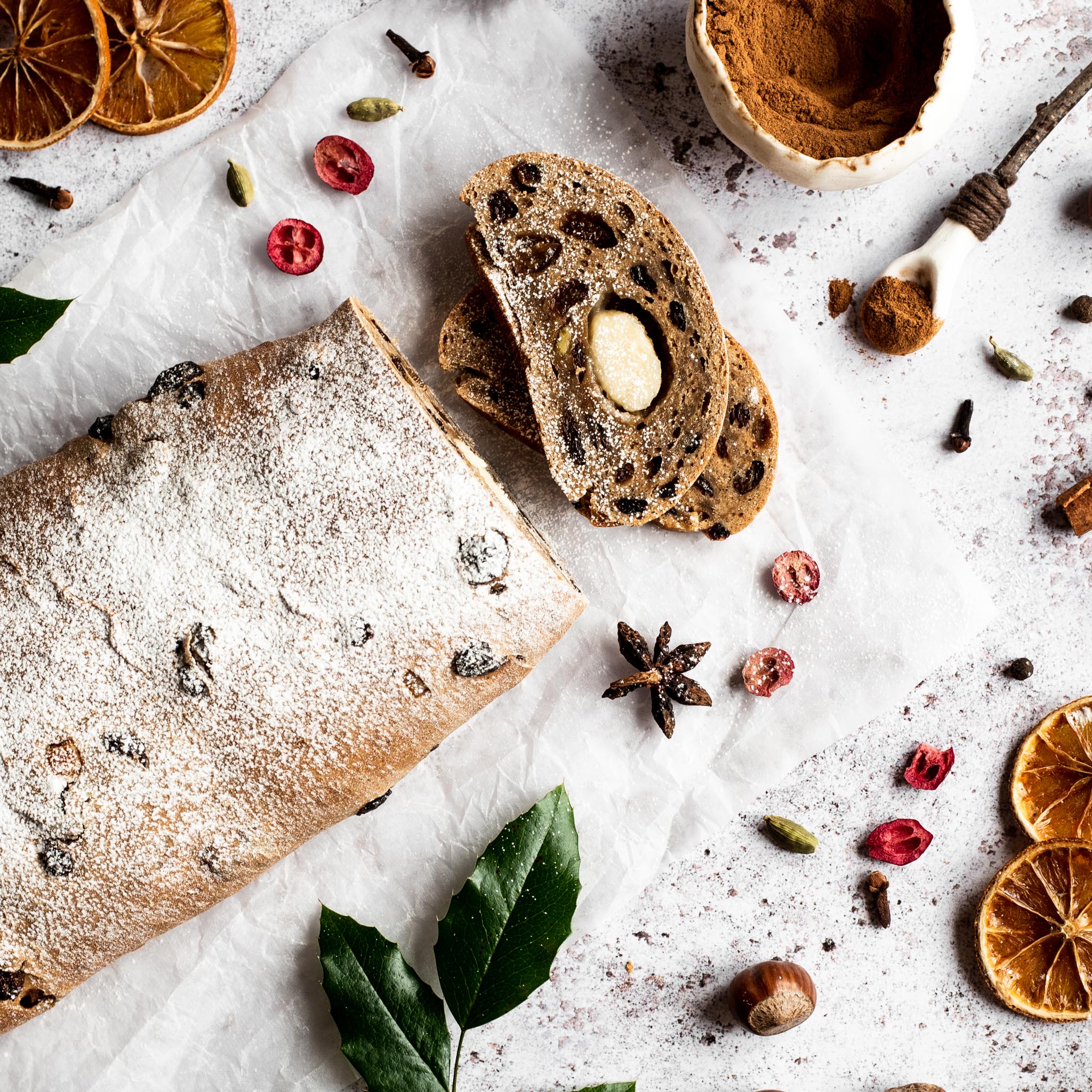 Vegan stollen with a slice removed showing marzipan in the middle