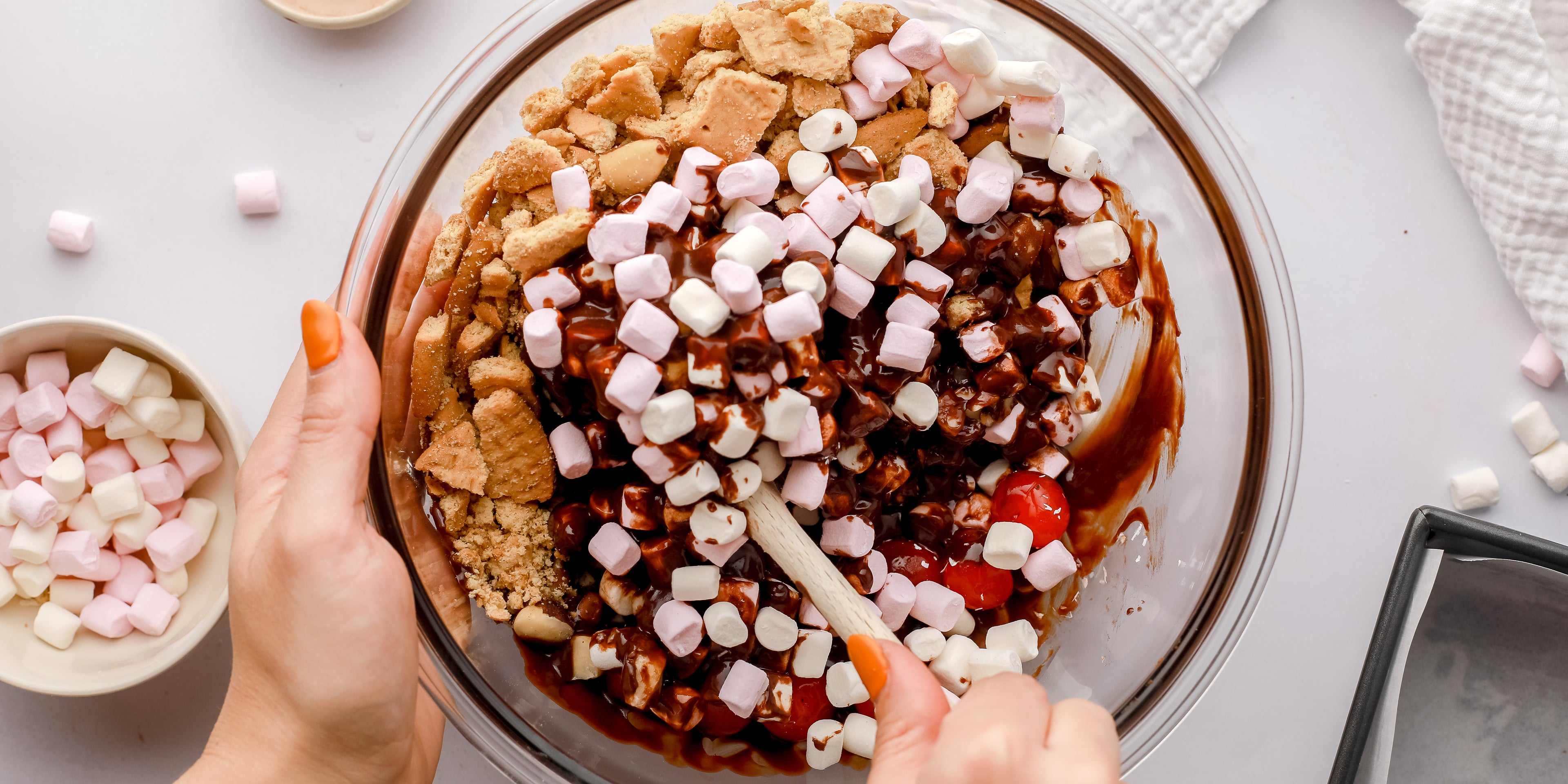 Rocky road ingredients being mixed together in a bowl