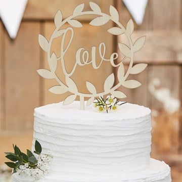 Cake Topper with 'love' written on it