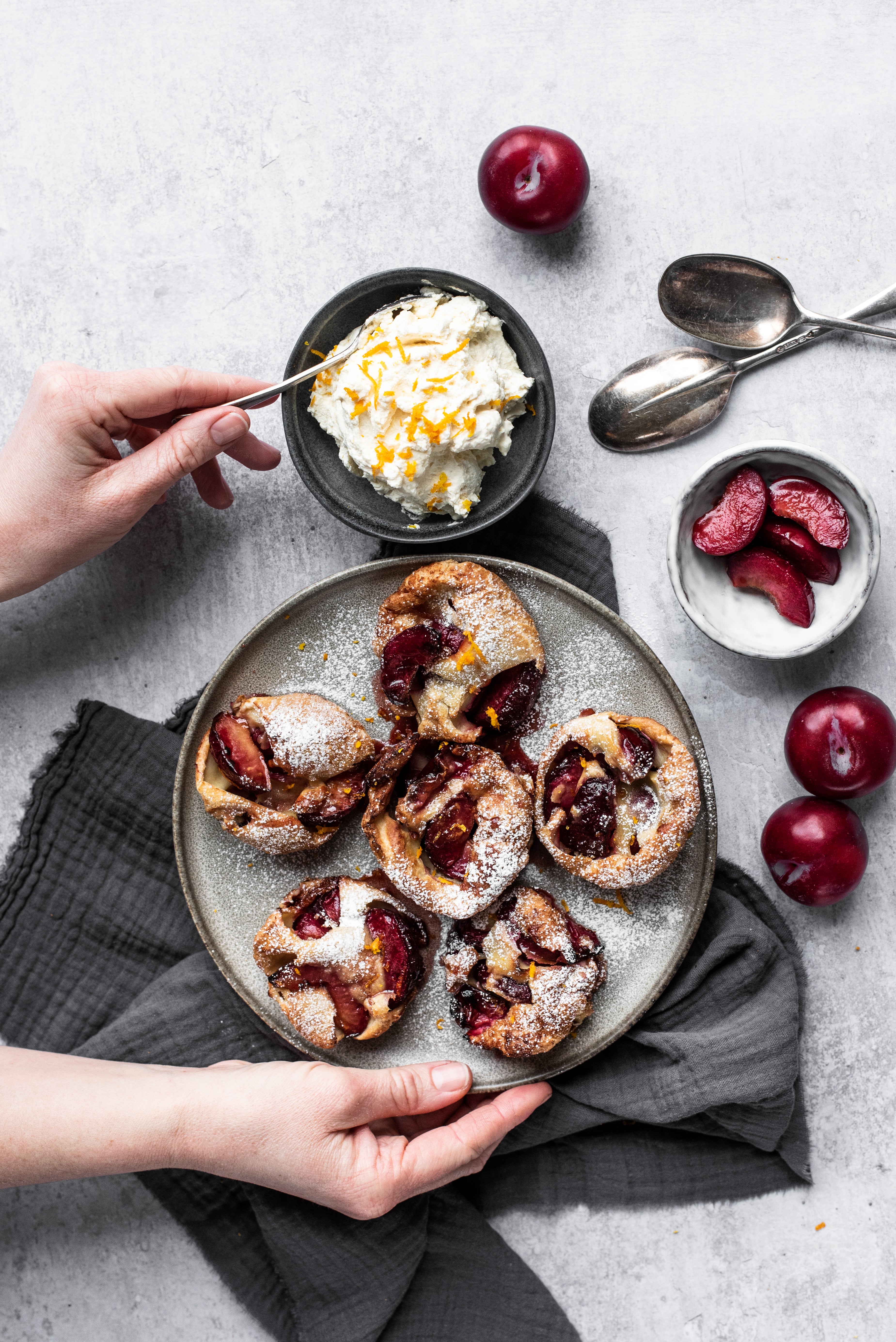 caramelised plum yorkshire puddings on plates