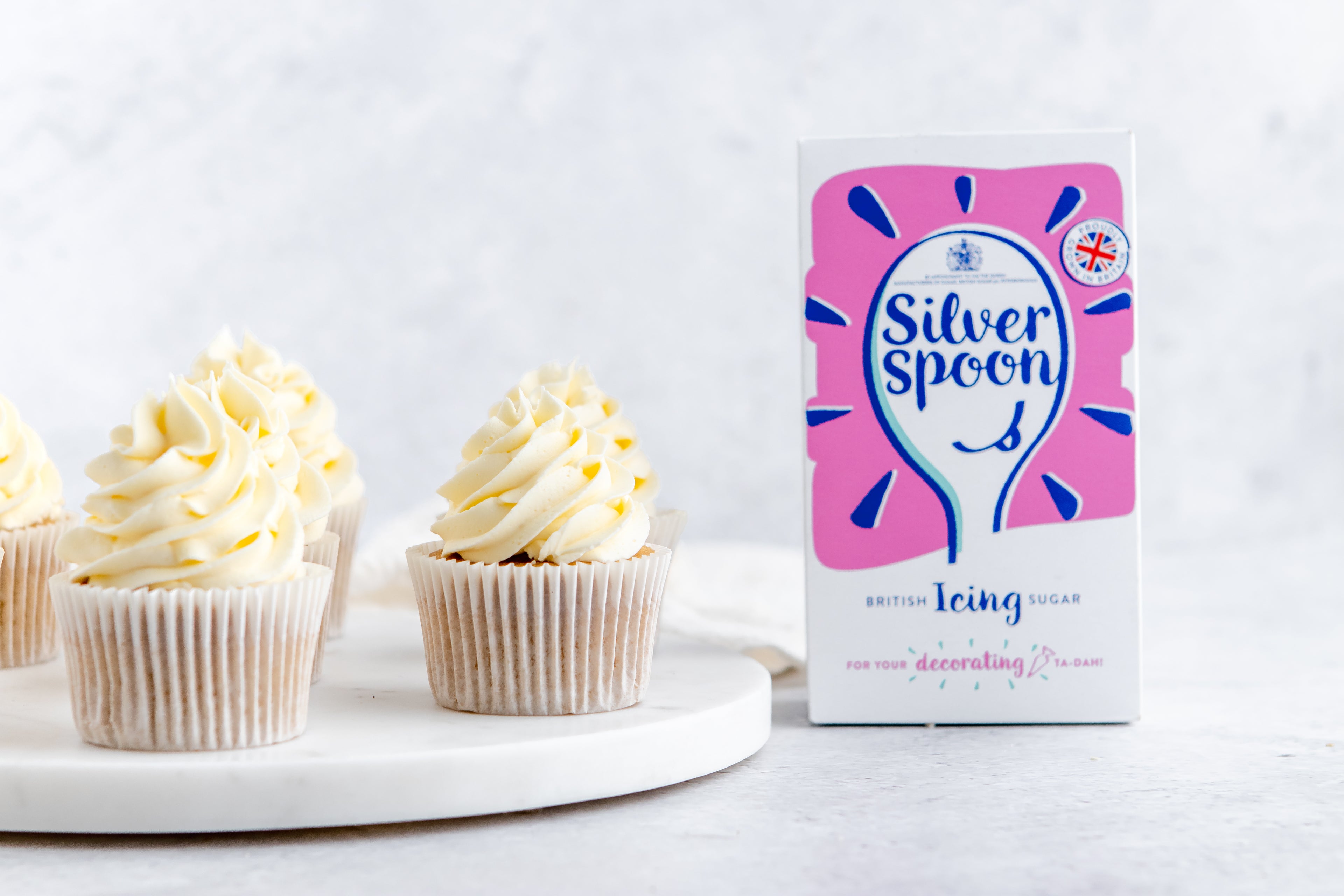 Gluten Free Cupcakes placed next to a box of Silver Spoon Icing sugar