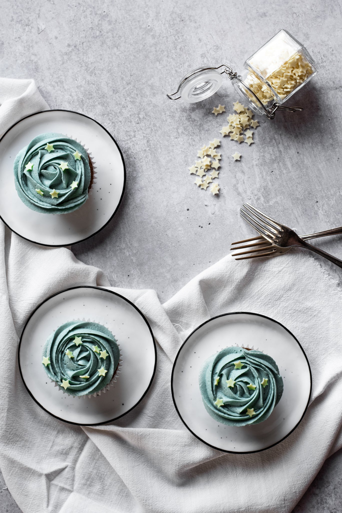 Bird's eye view of Earl Grey cupcakes on a pair of white plates