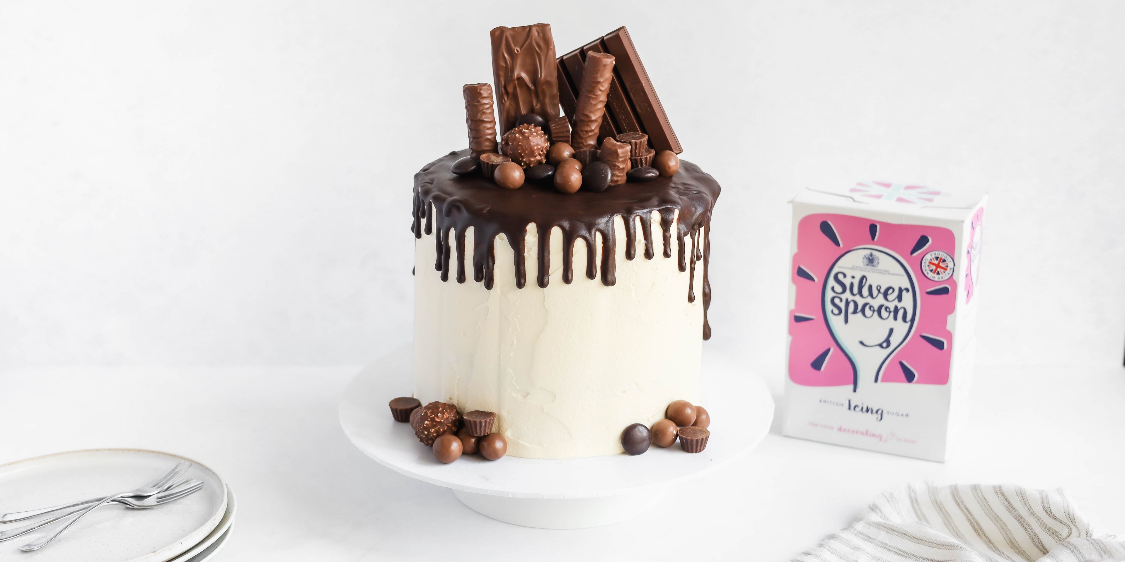 Ultimate Birthday Drip Cake next to a box of Silver Spoon Icing Sugar 