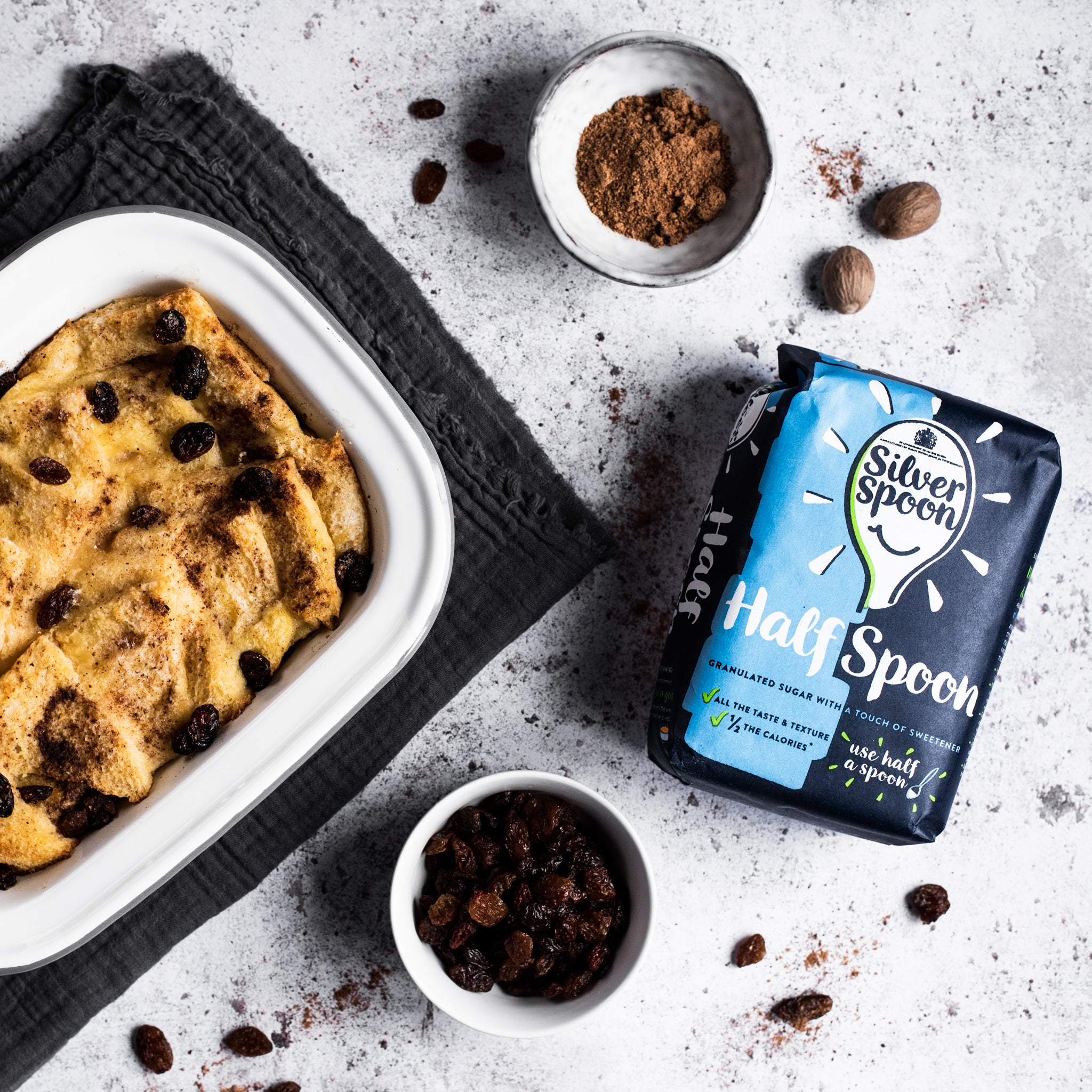 Bread and butter pudding in a tin with raisins