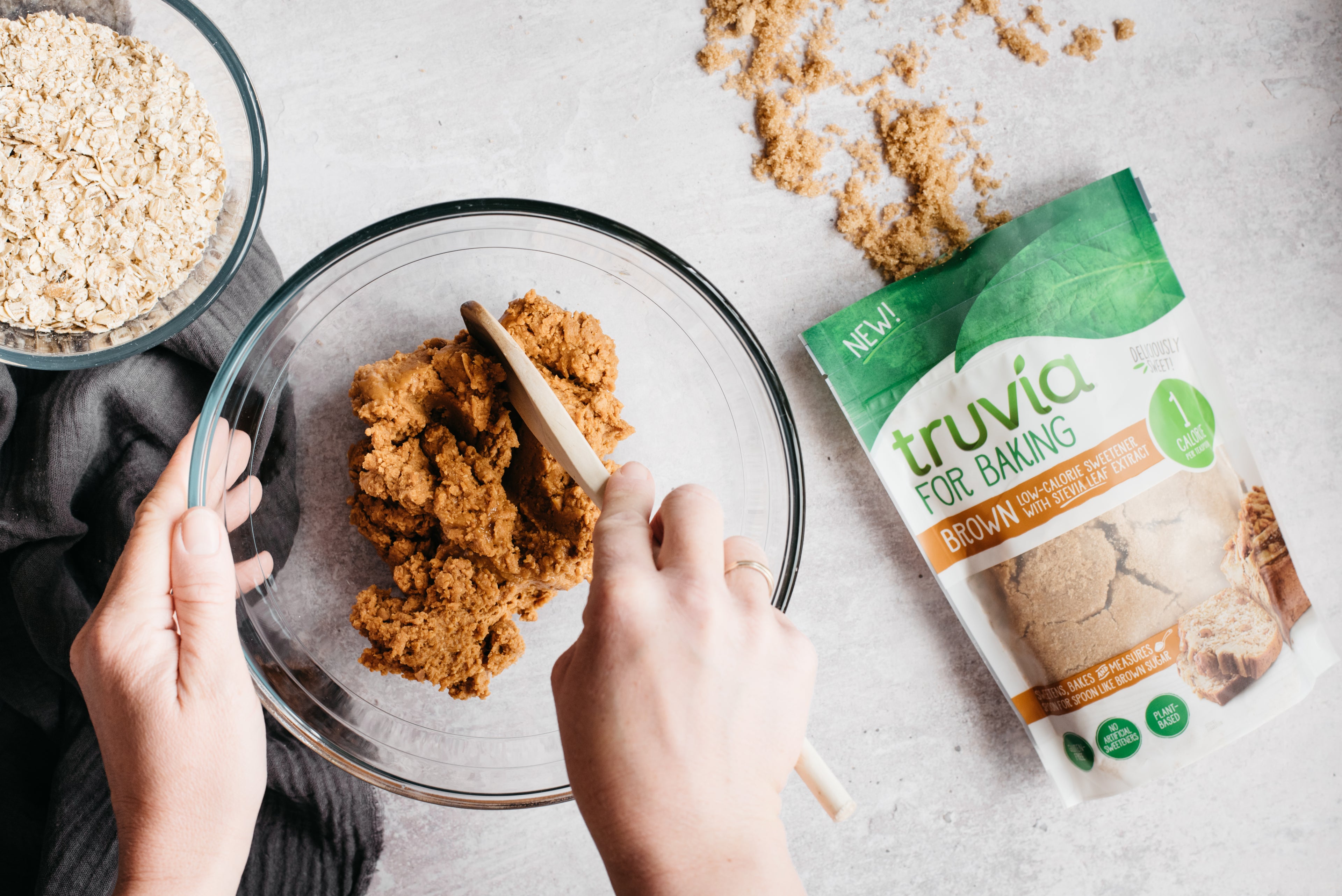 Top view of Chocolate Peanut Butter Squares being mixed in a bowl, next to a bag of Truvia for Baking Brown