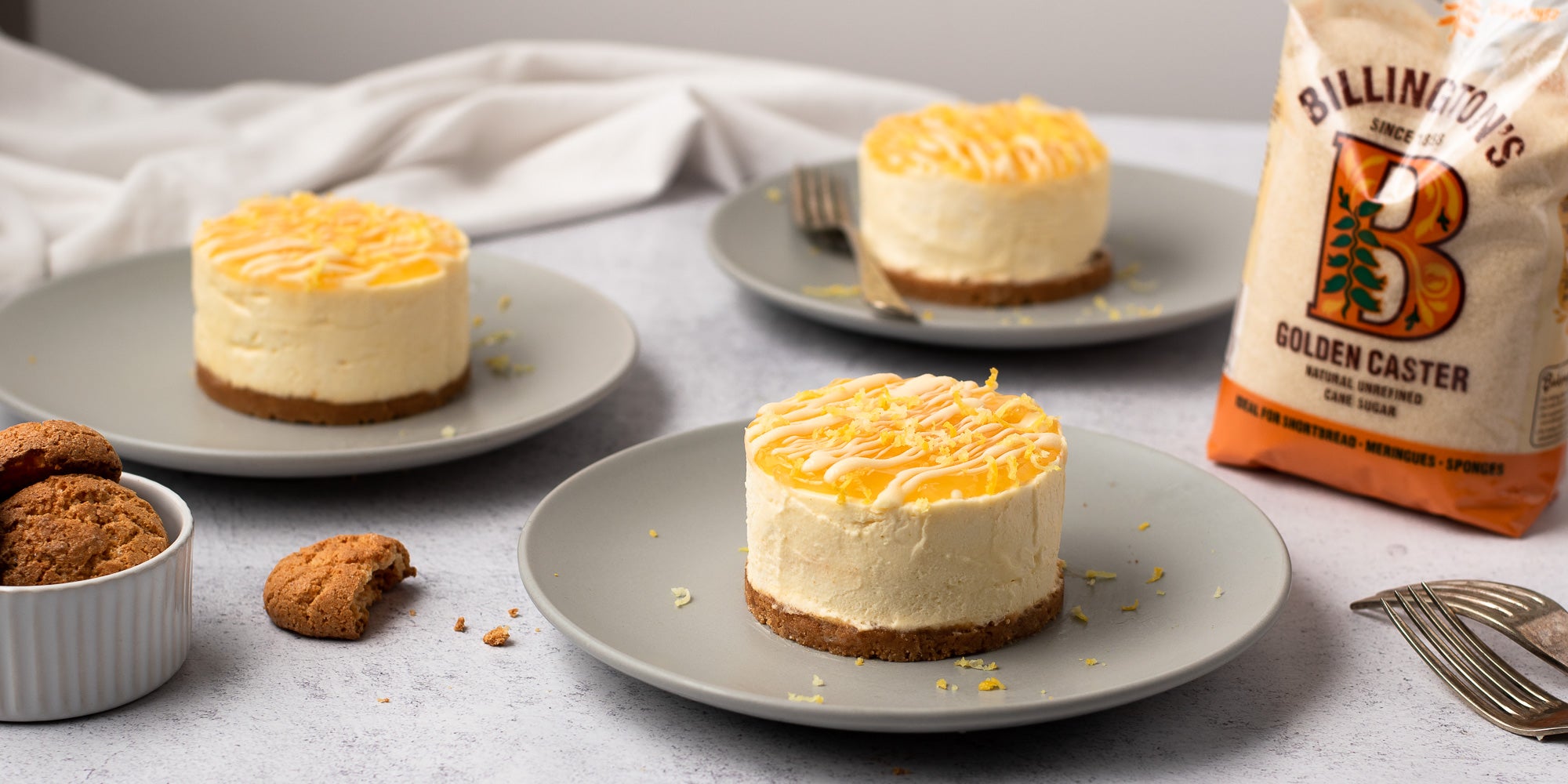 Three Mini Lemon Amaretti Cheesecakes on plates