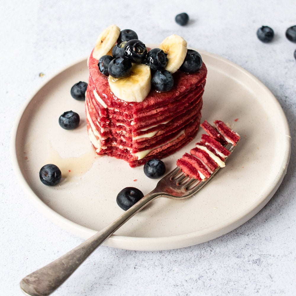 stack of red velvet pancakes with fork
