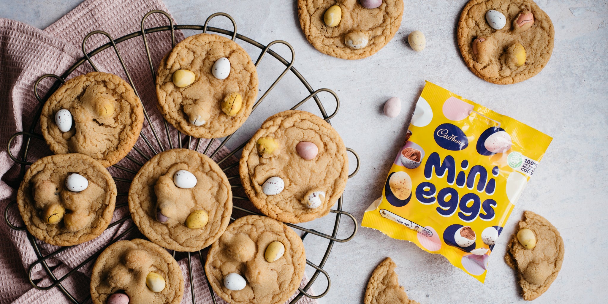 Mini Egg Millies Cookies on a circular cooling rack