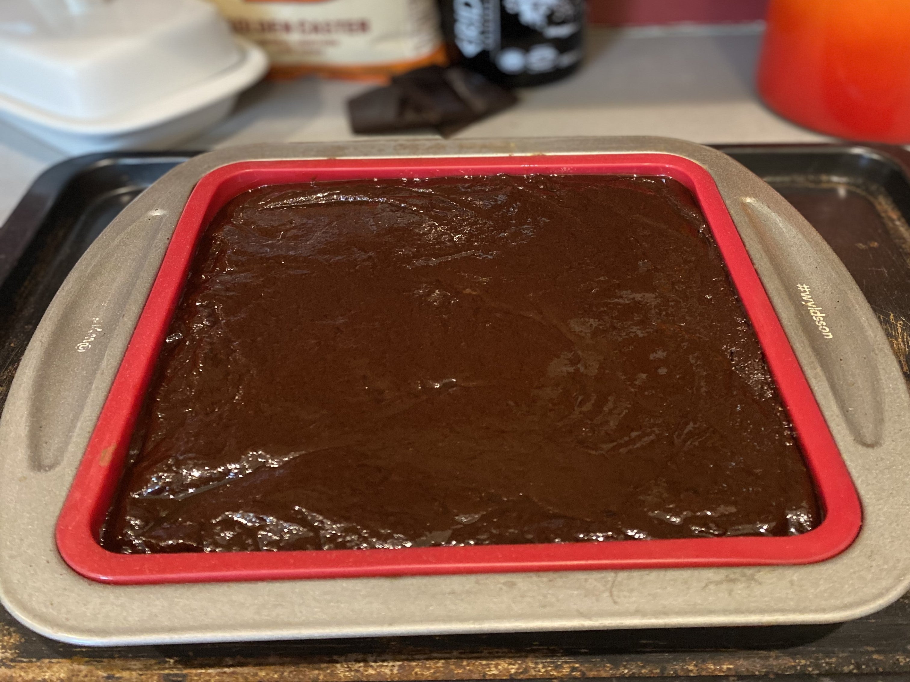 Jamie Oliver brownie batter inside a silicone brownie tray