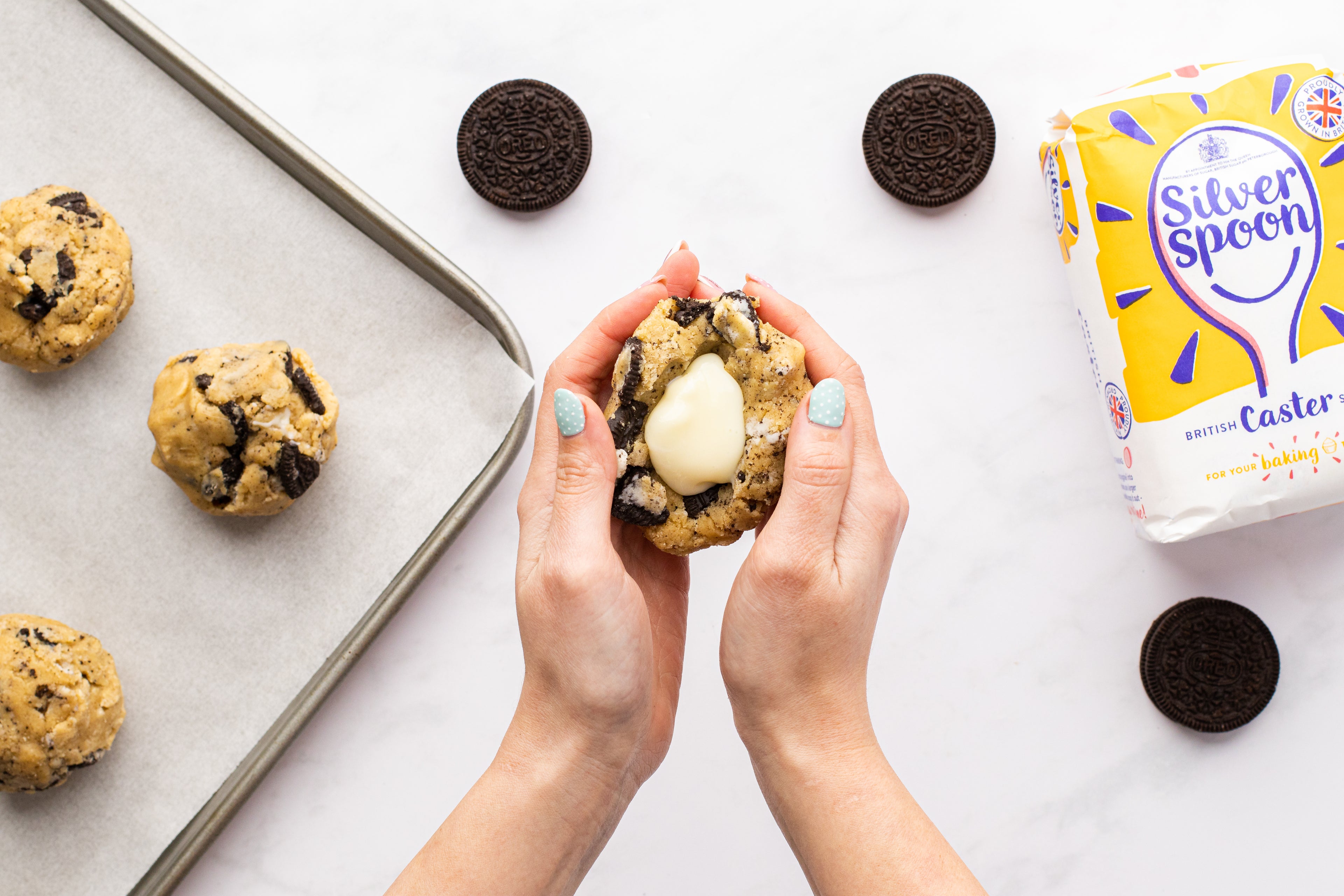 Hand shaping cookie mixture into balls