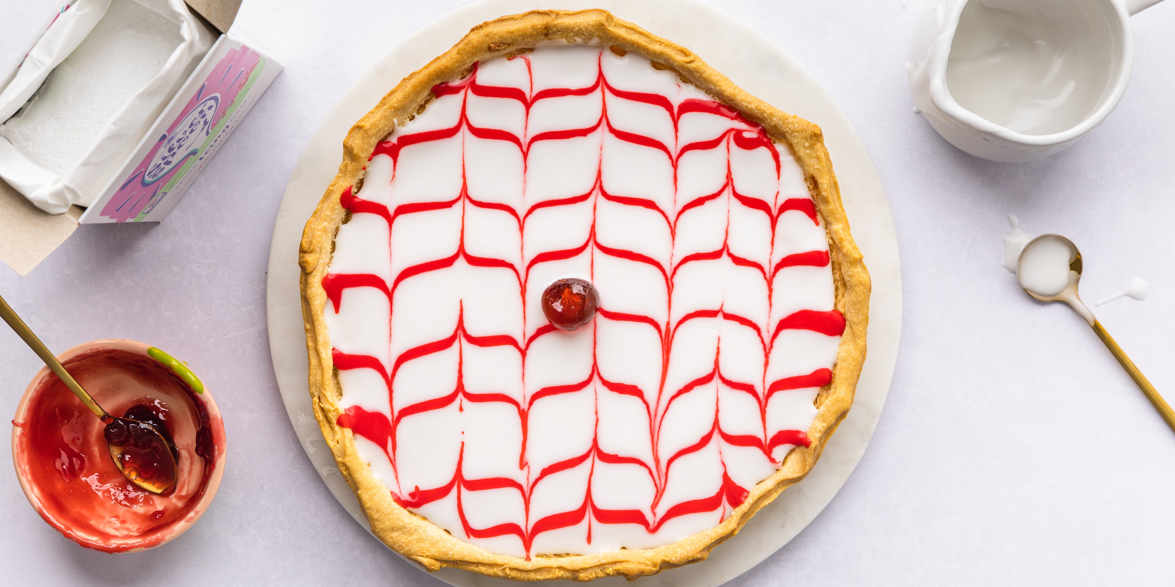 Bakewell tart beside an empty bowl of jam