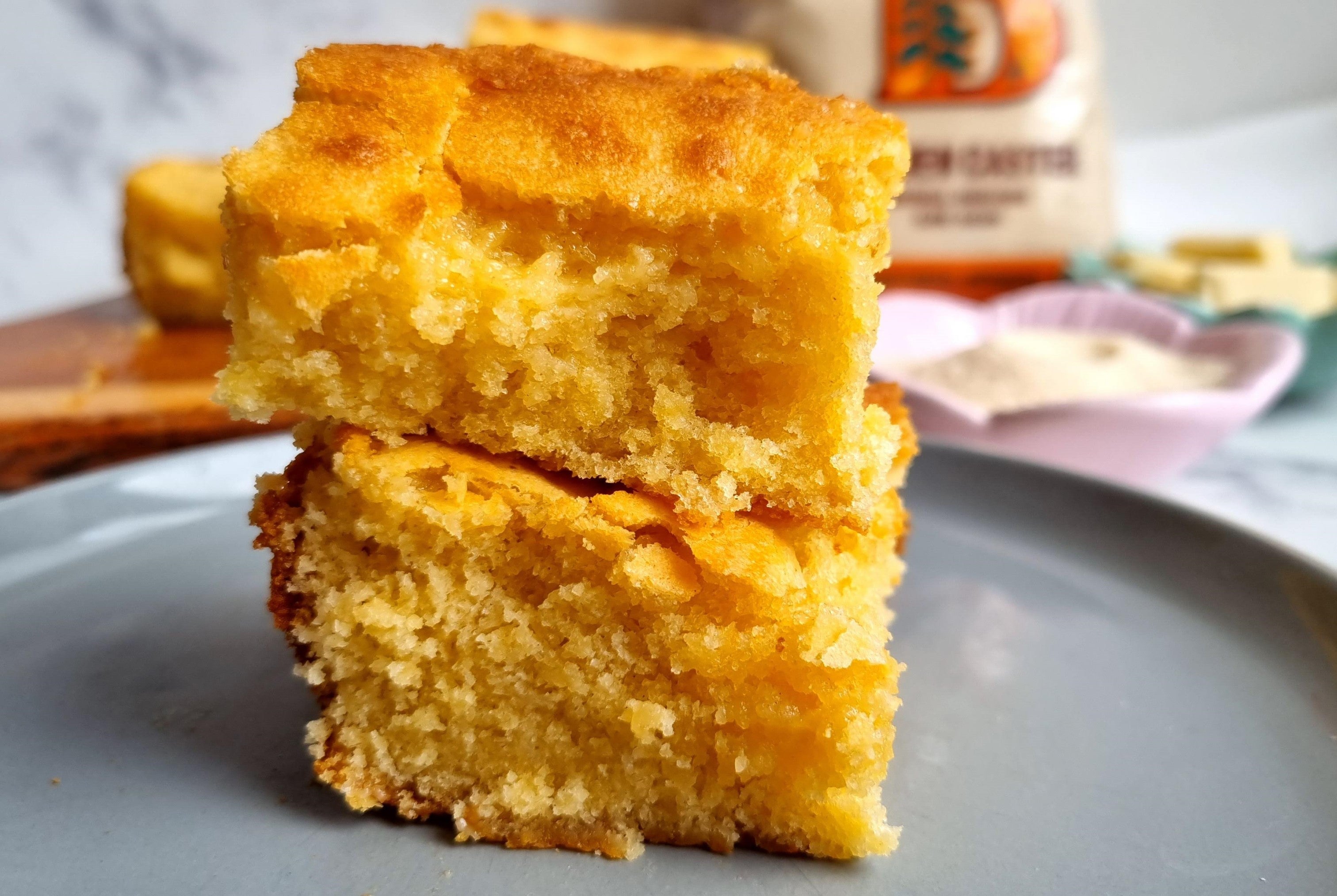 Two white chocolate brownies stacked, with one on top of the other