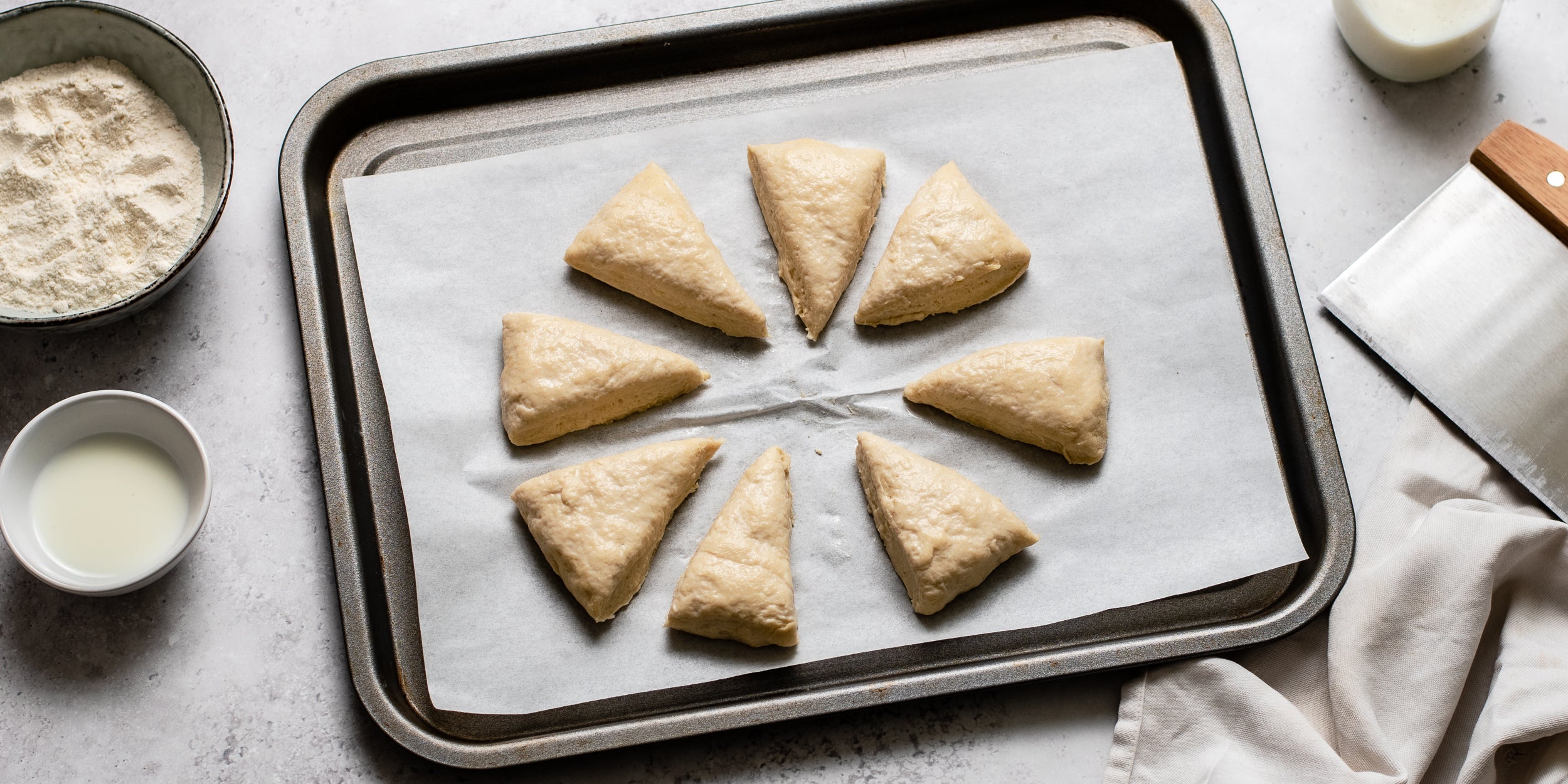 Easy Scones cut into portions on a lined baking tray ready to bake