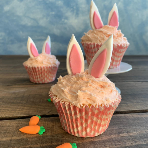 Bunny cupcakes with pink icing and pink and white bunny ears