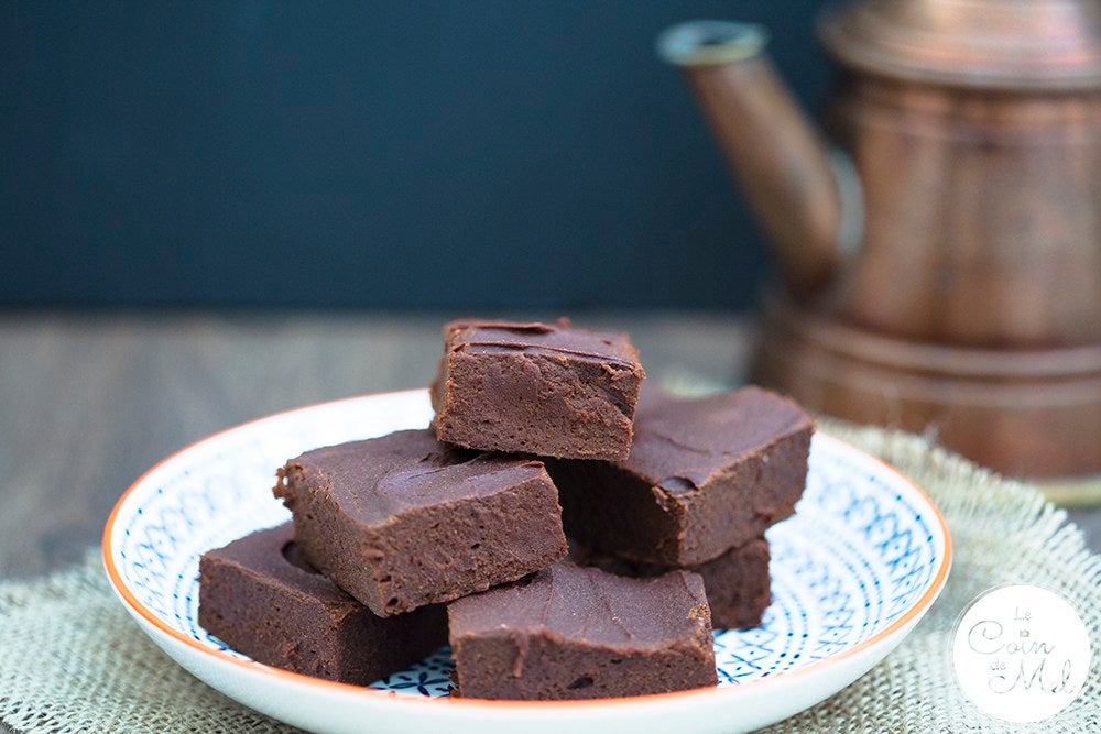 Gluten-free chocolate brownies on a blue and white plate