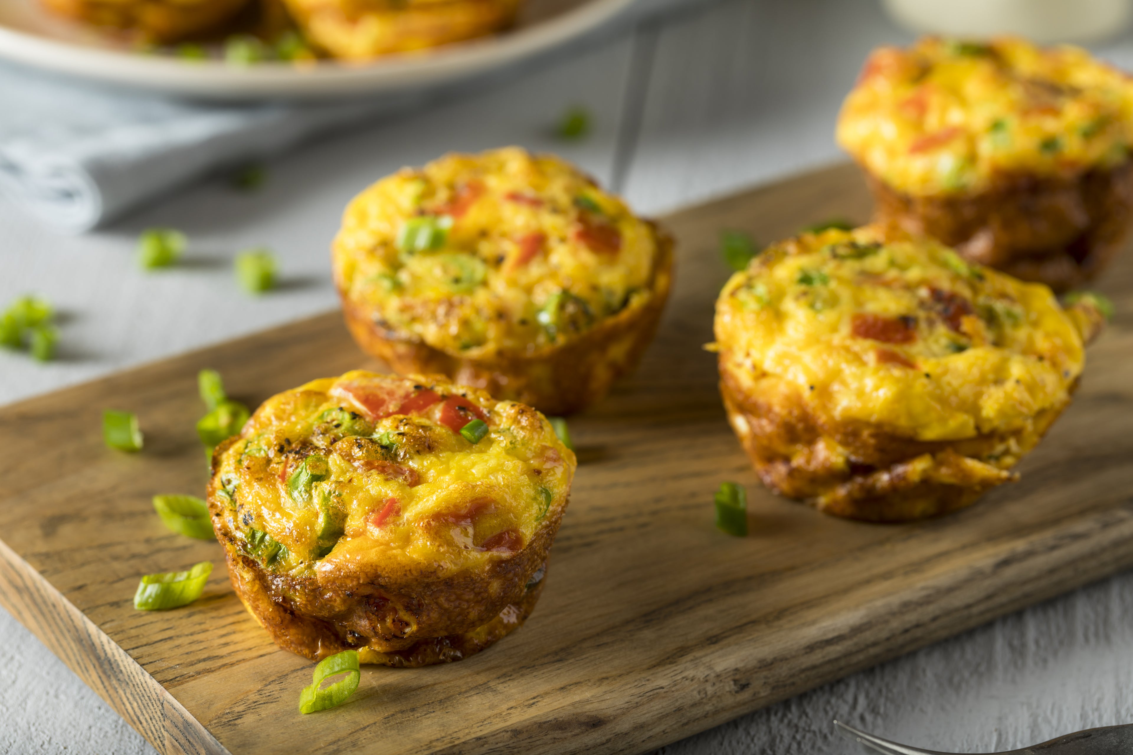 Low carb keto egg muffins with spring onions and pesto