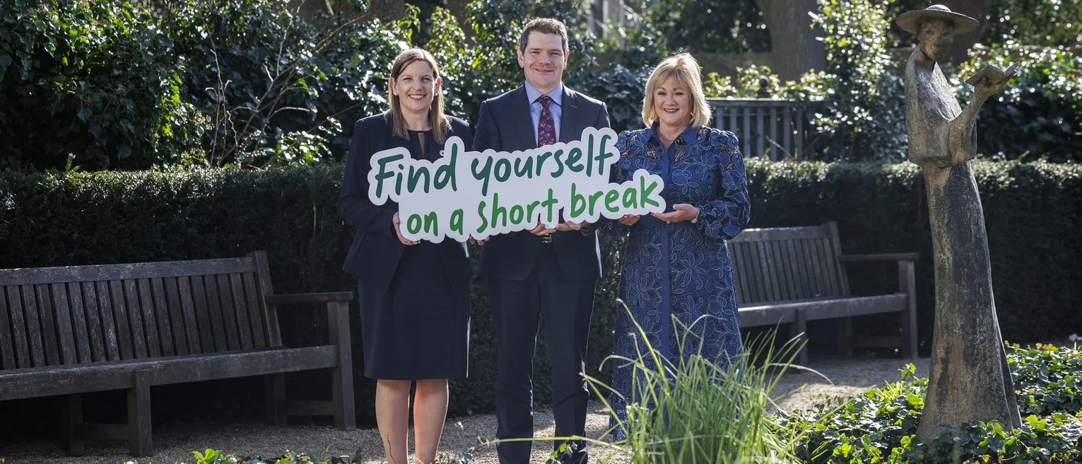 Minister for Tourism Peter Burke TD and Caroline Bocquel, CEO of Fáilte Ireland hold a sign with Short Break campaign slogan.