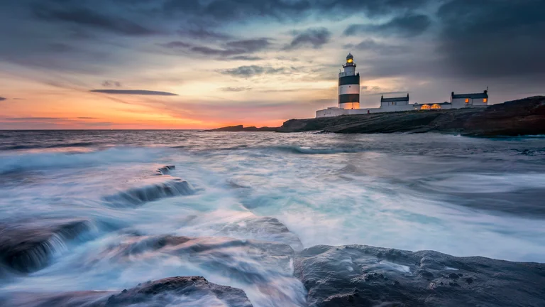 Hook Head lighthouse on a rocky shore