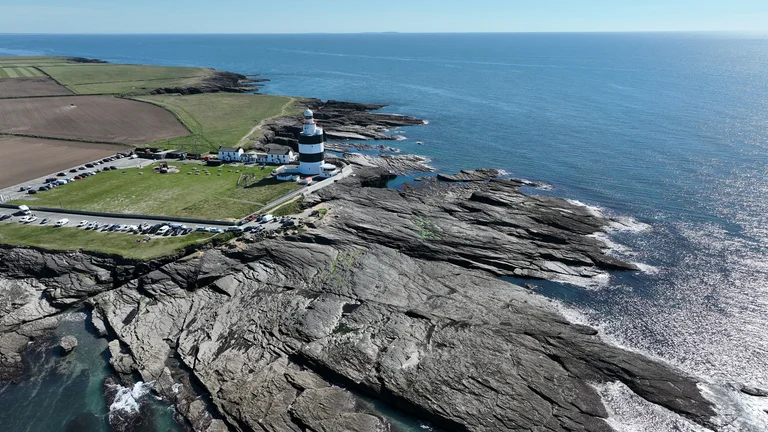 A lighthouse on a rocky shore