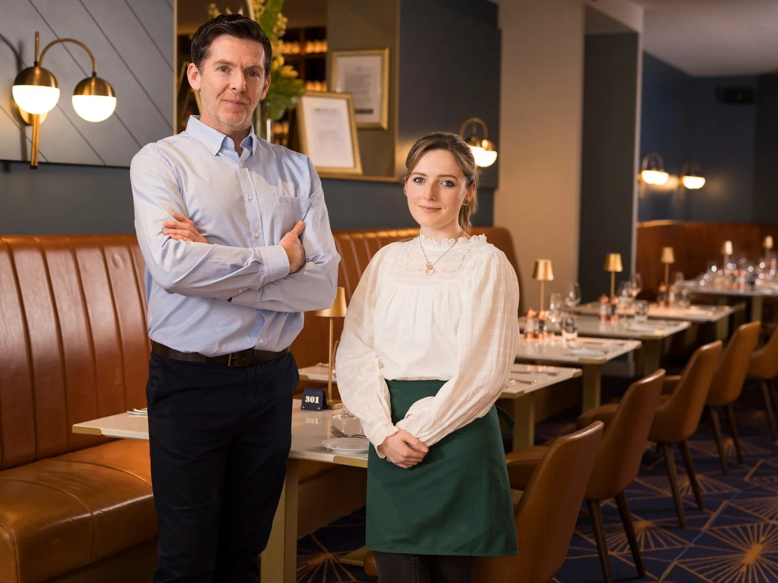 Restaurant staff standing together in a fine dining restaurant