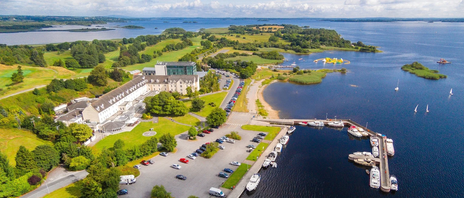 Aerial shot of lake side town on a sunny day.