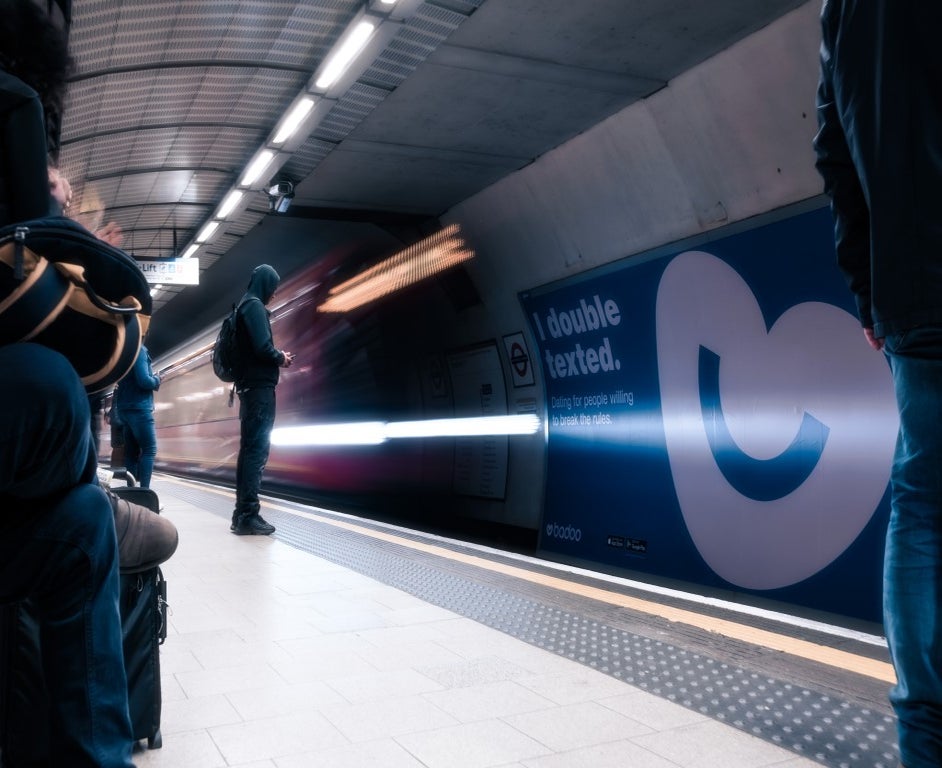 Man texting on a platform