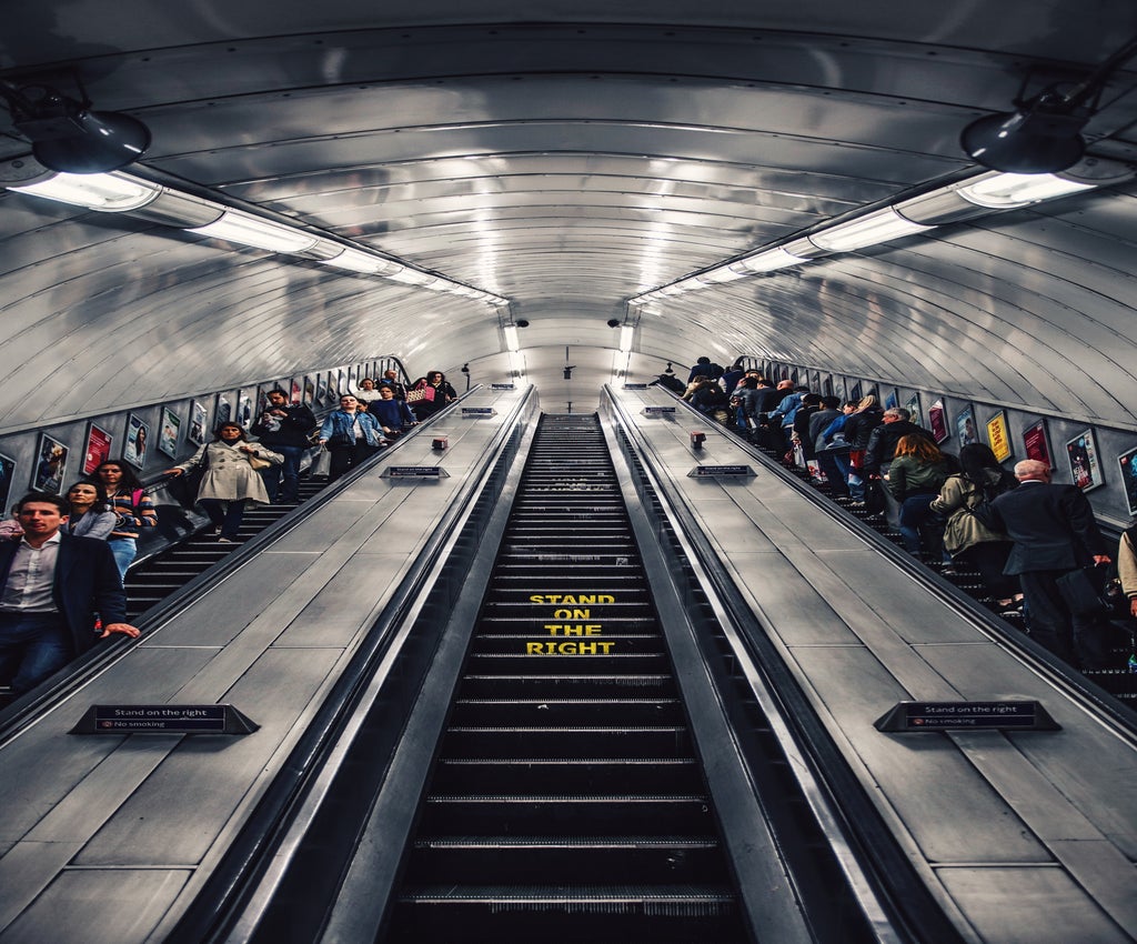 People on an escalator in London Underground