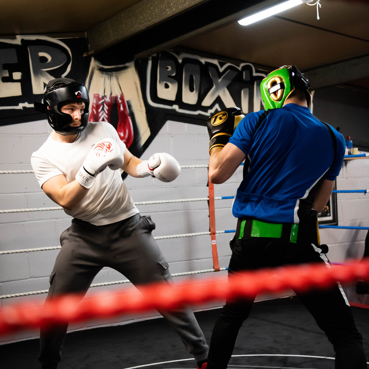 two people boxing each other