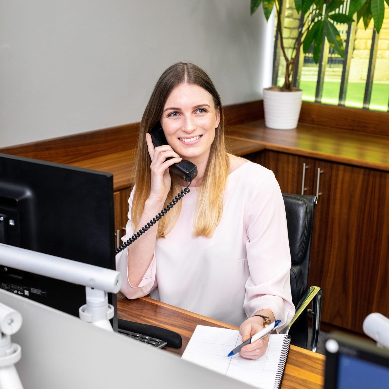 Hannah writing at desk