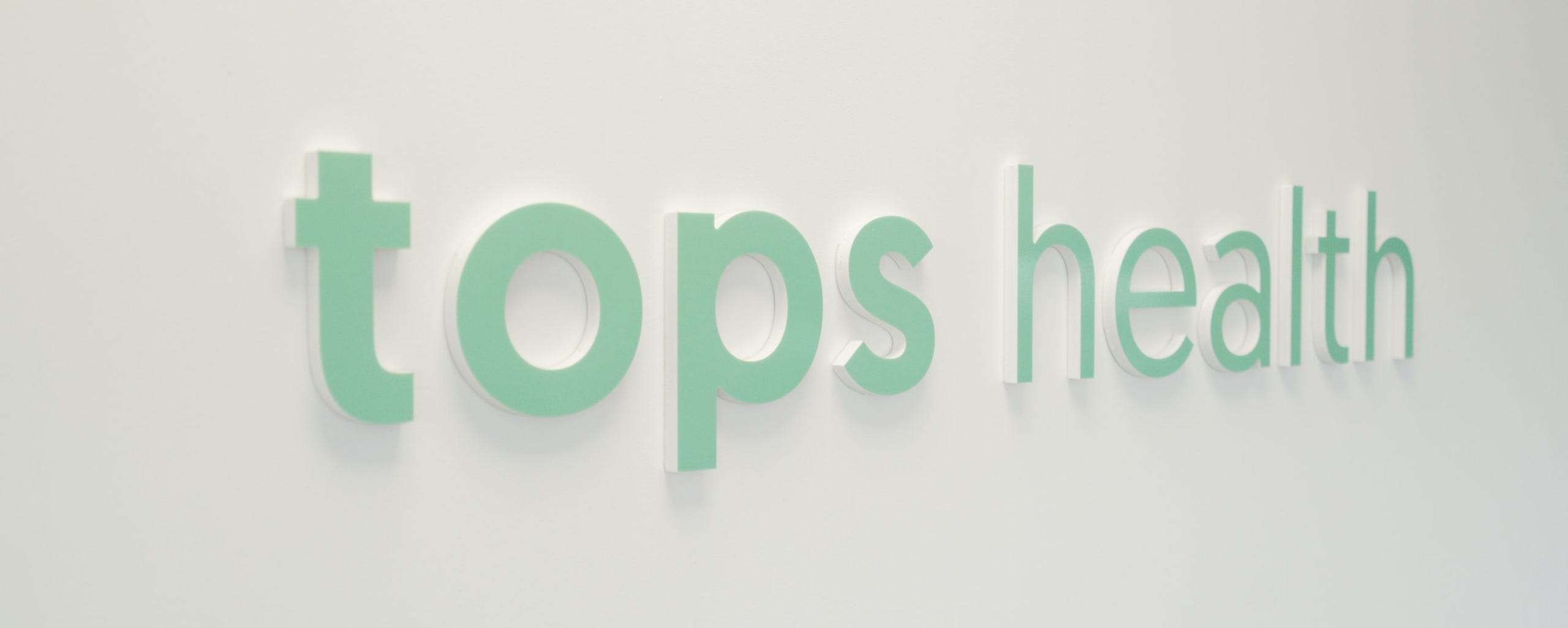 tops health sign on wall