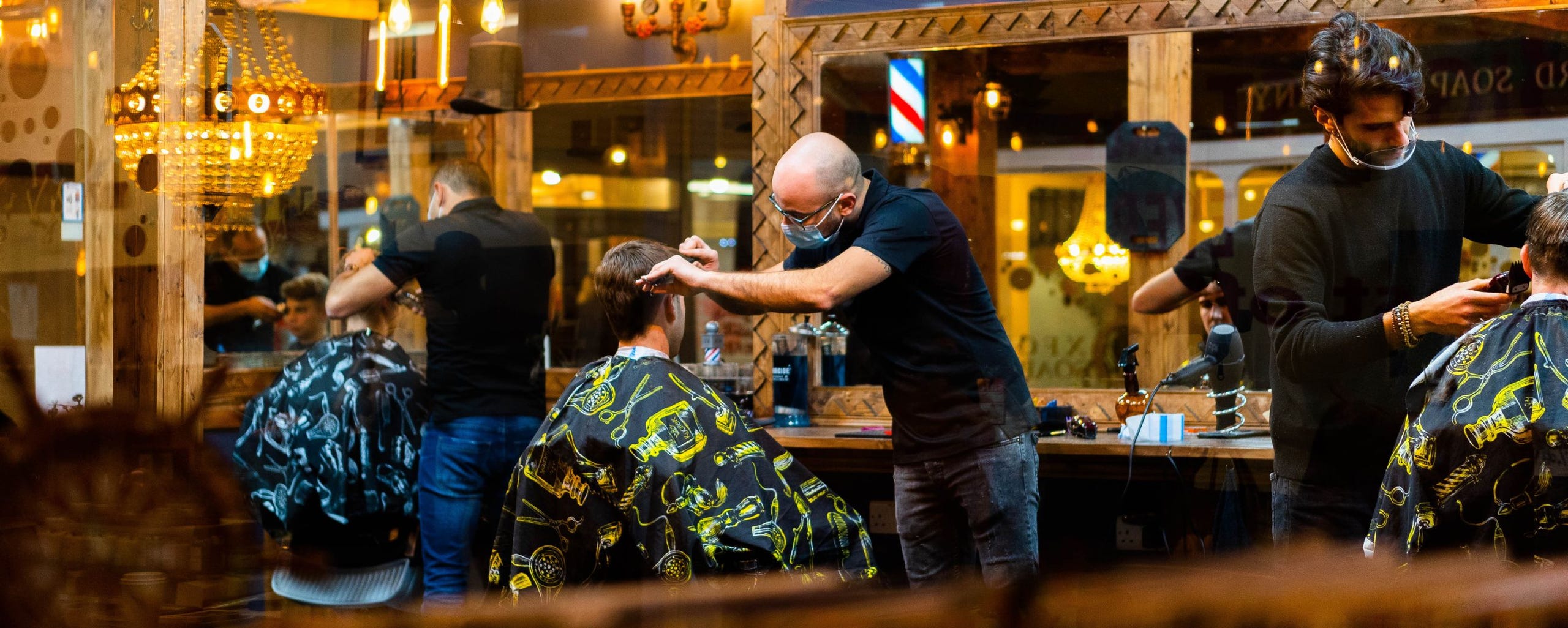 barbers cutting hair 