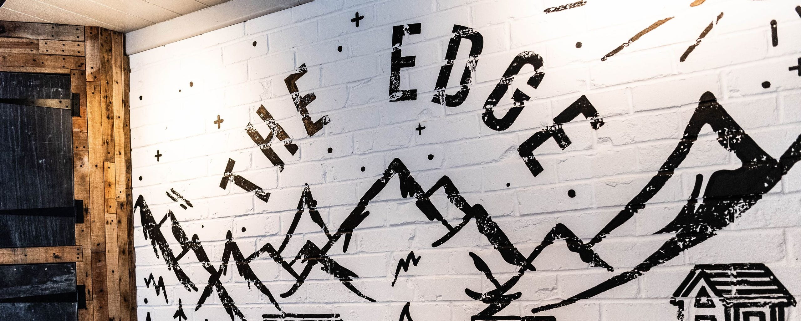 wall art of mountains and The Edge