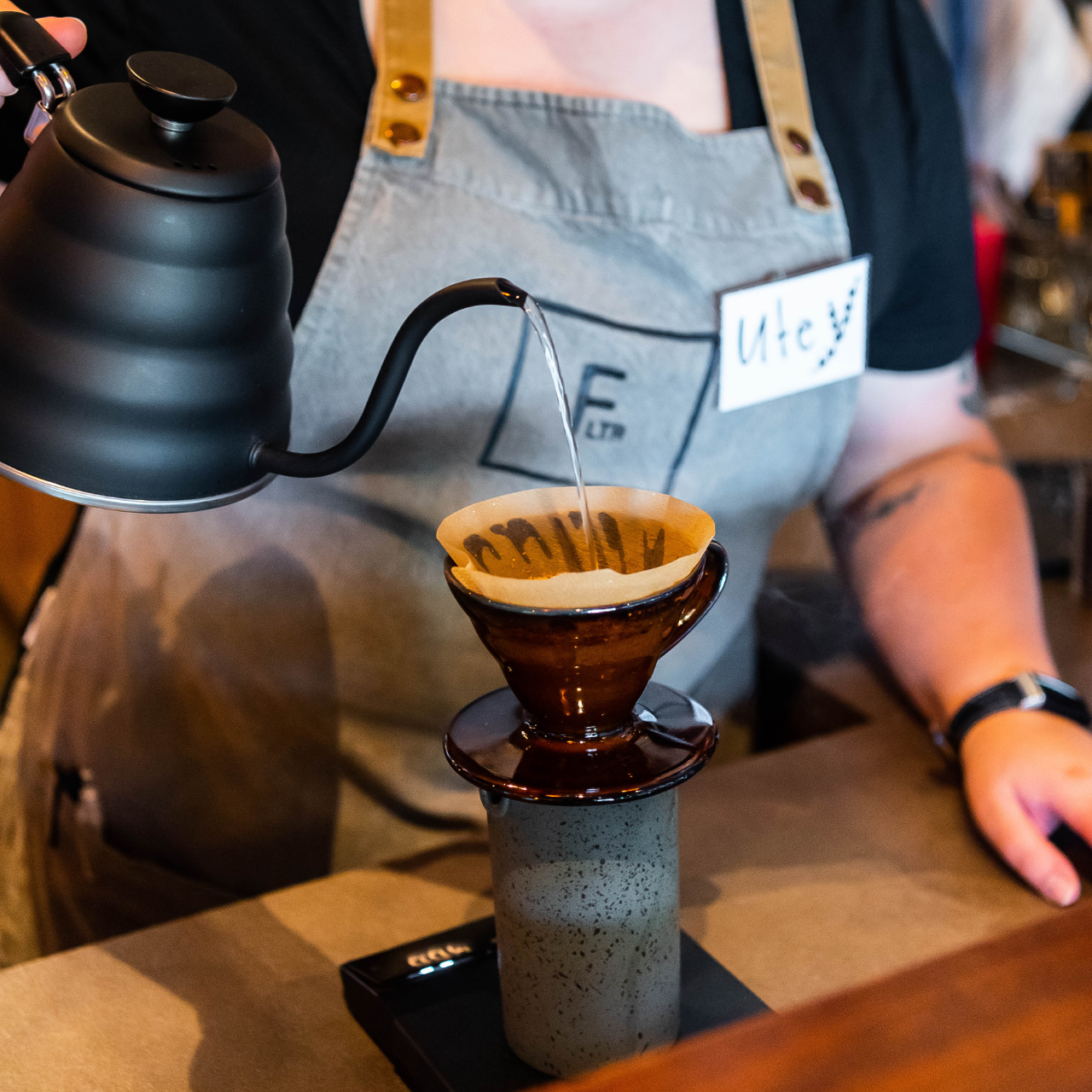 photo of someone pouring coffee 