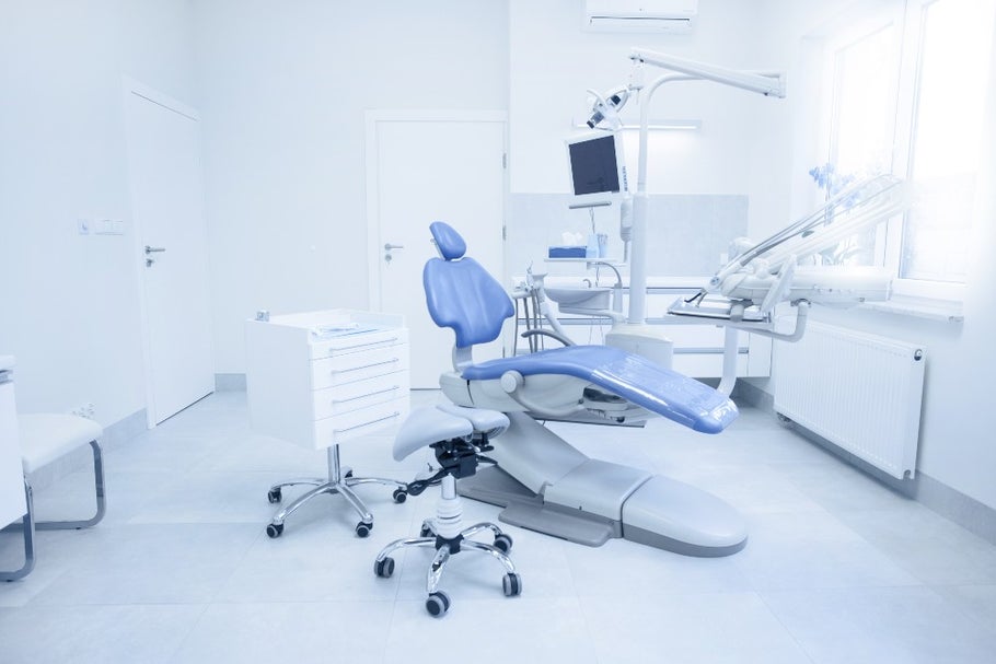 empty dental surgery with chair and equipment 