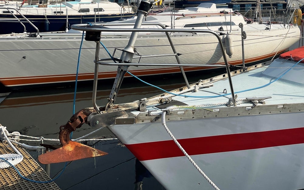 Close up of two boats on a marina.