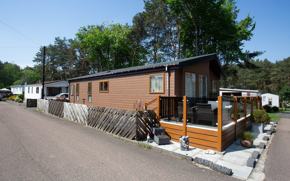 Close up shot of a modern holiday home with a balcony.