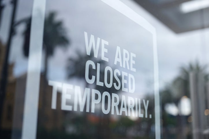 black and white sign in a shop window reads sorry we are temporarily closed. Business interruption insurance can cover for temporary closure