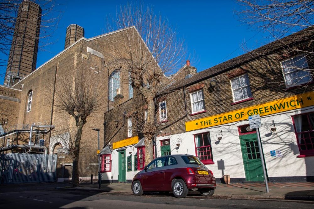 The bright yellow exterior of The Star of Greenwich. Photo by Josh Bright.