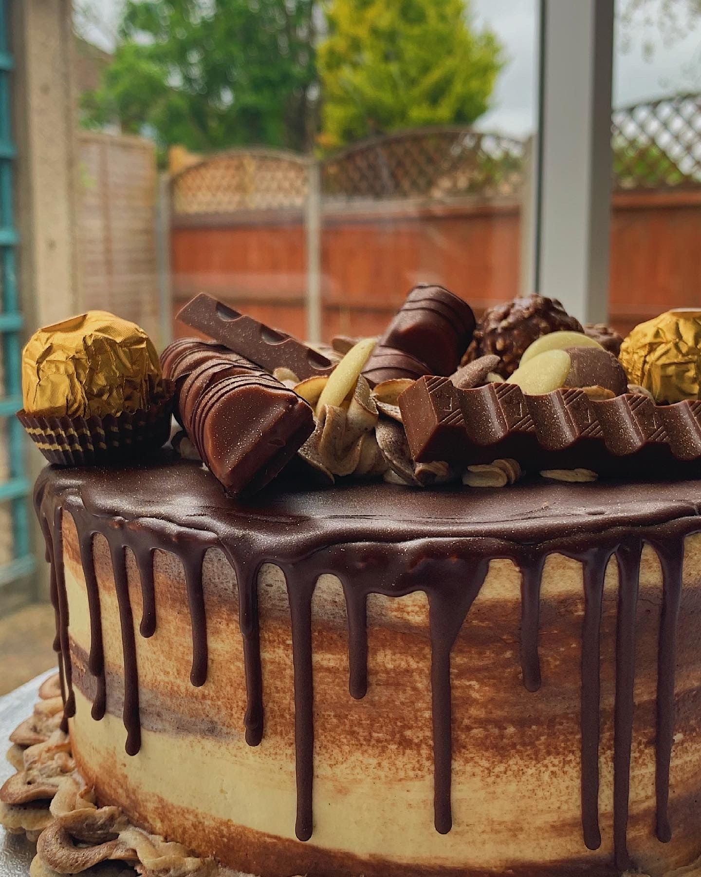 One of Bobby's Bakes creations is a cake decorated with Kinder and Ferrero chocolates