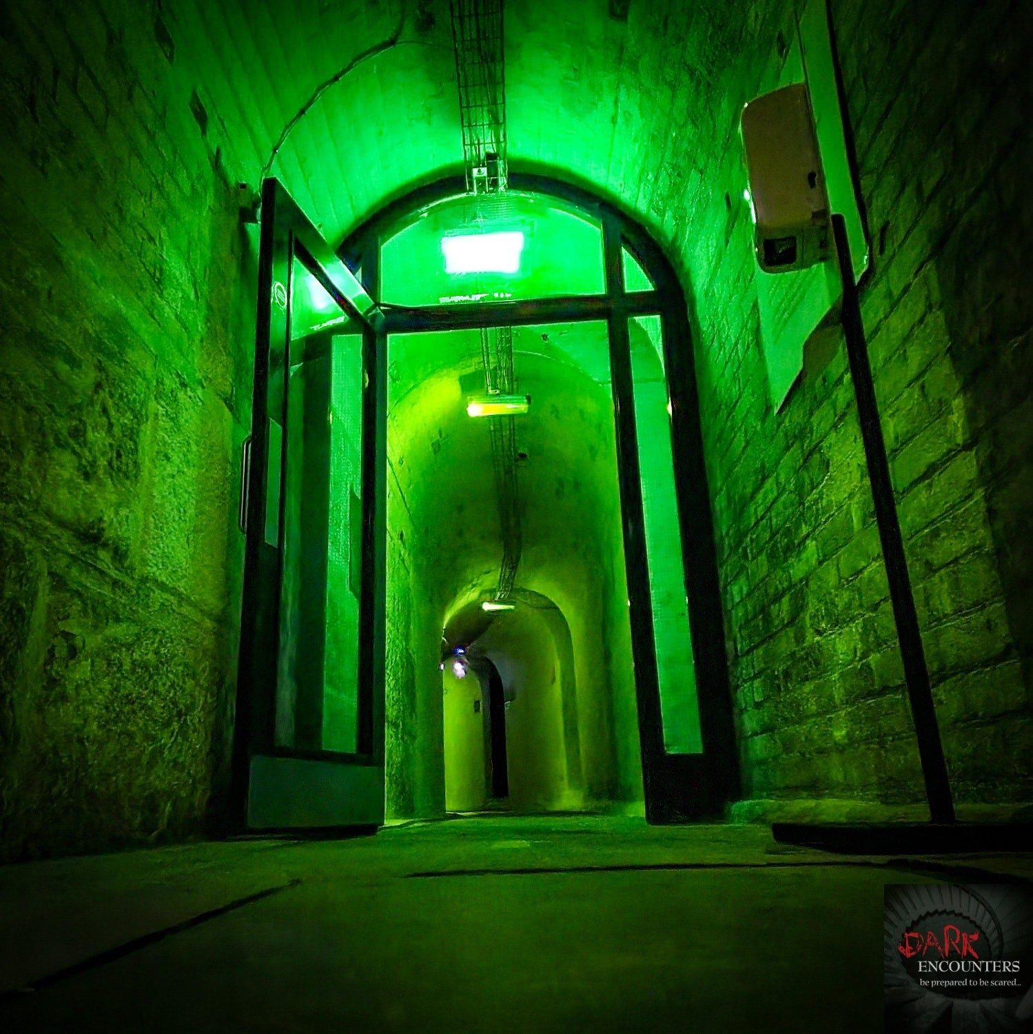 An ominous green corridor leads into a mystery haunted location