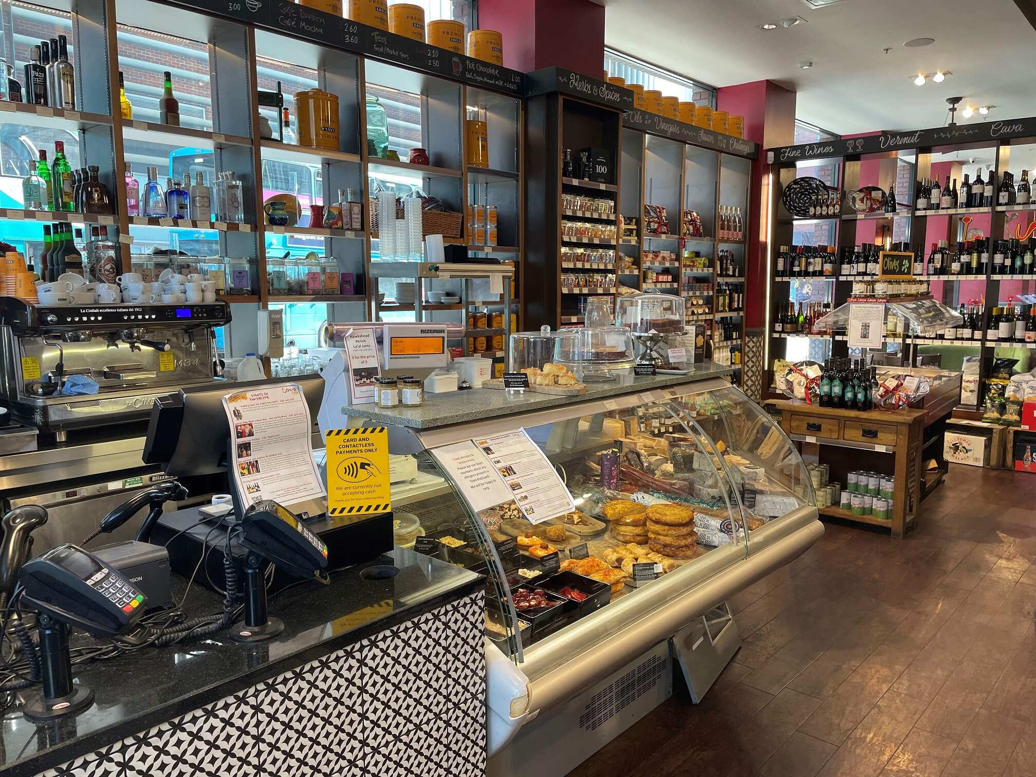 Interior of Lunya restaurant and deli, showing the deli counter and a selection of wine