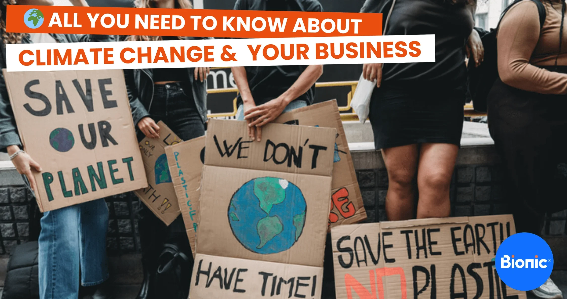 A group of people hold up 'save the environment' signs. The caption reads: ALL YOU NEED TO KNOW ABOUT CLIMATE CHANGE & YOUR BUSINESS