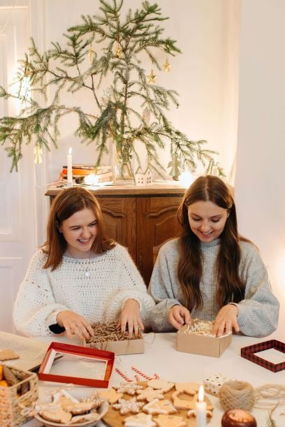 Two small business owners unpack Christmas craft boxes