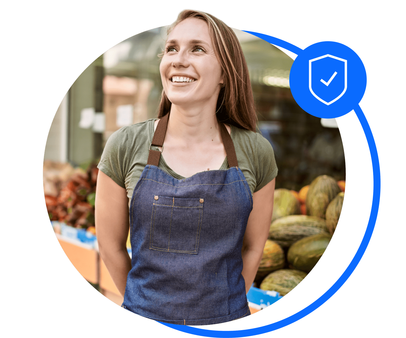 A shop owner stands oustide her fruit and veg stall after arranging her shop insurance