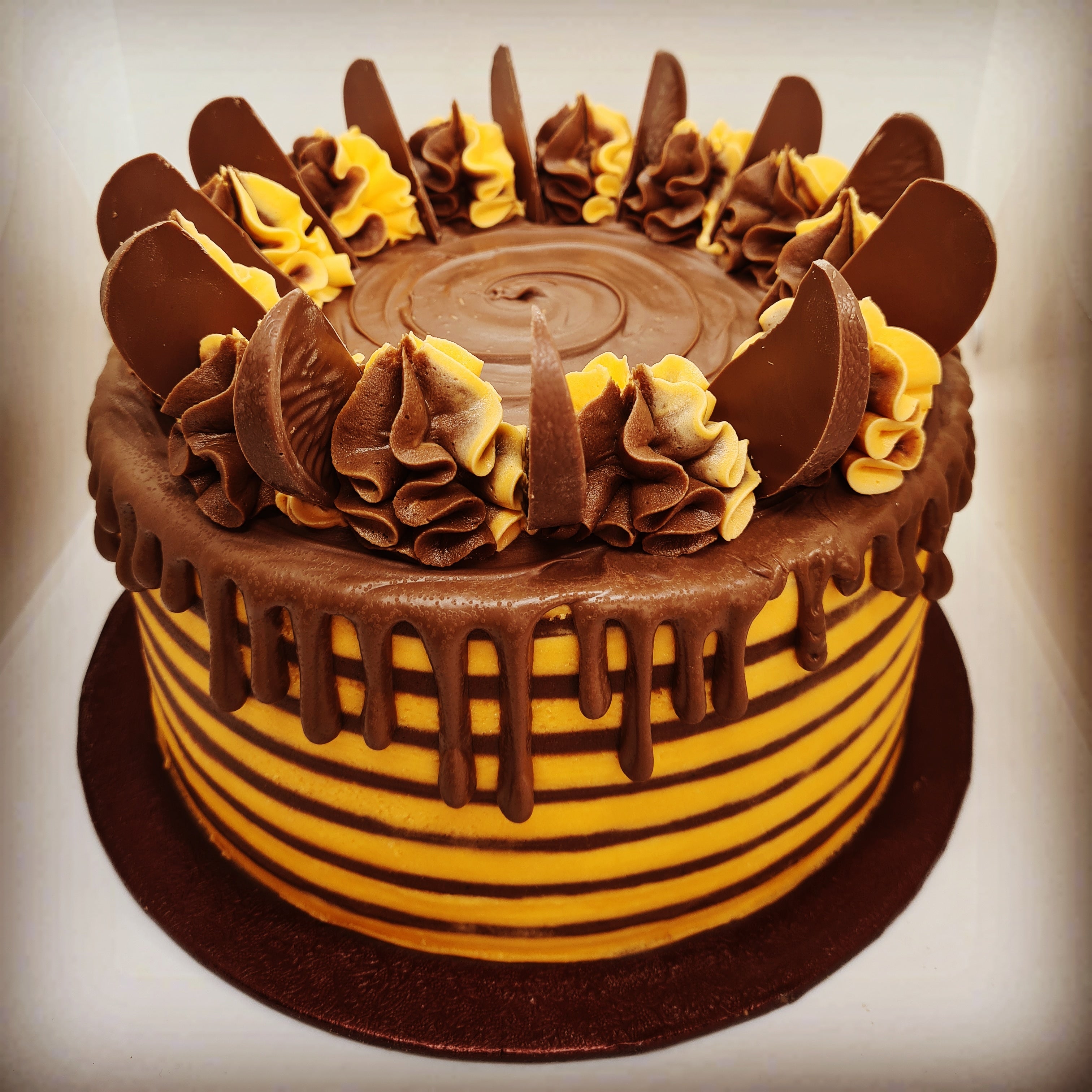 A chocolate orange cake with chocolate top and chocolate orange pieces